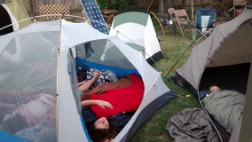 Picture of kids sleeping  while tent camping