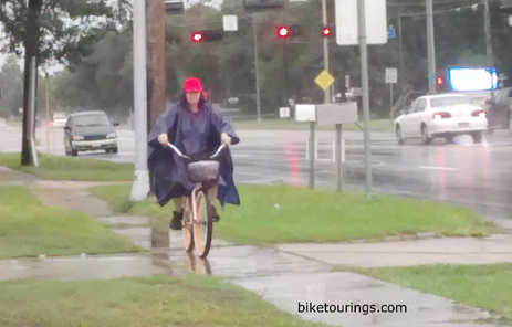 Picture bike commuter in rain with rain gear