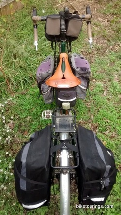 Picture of touring bike with front and rear panniers attached to racks for bicycle touring