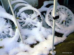 Picture of snow covered bicycle wheels for winter bicycle commuting