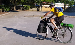 Picture bike touring and following shadow to stay cool