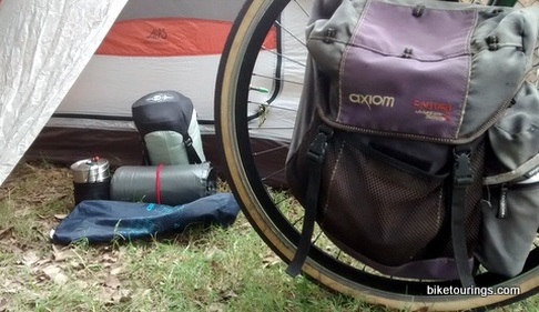 Picture of touring bike with assorted gear for packing kit.