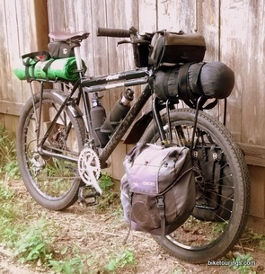 Picture of touring bike being picked up and carried