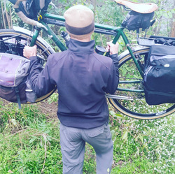 Picture of loaded touring bike being carried for bike portage